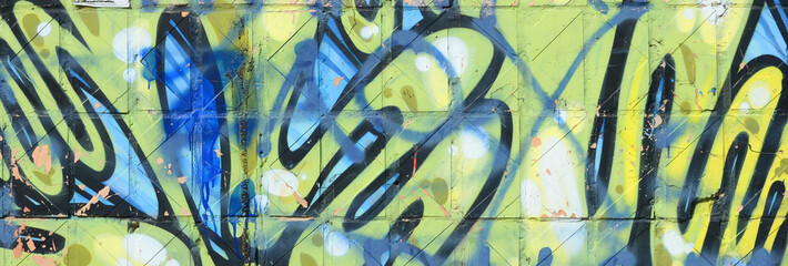 Fragment of colored street art graffiti paintings with contours and shading close up
