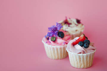 set of delicious cupcakes with different fillings and cream. Three muffin's with cream