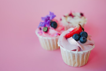 set of delicious cupcakes with different fillings and cream. Three muffin's with cream