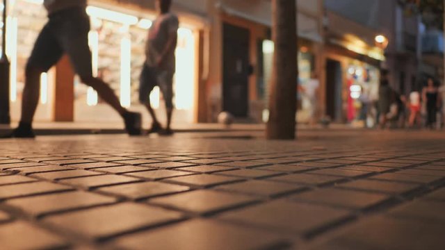 Shopping street in the tourist resort town of Catalonia Calella with tourists.