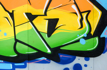 Fragment of colored street art graffiti paintings with contours and shading close up