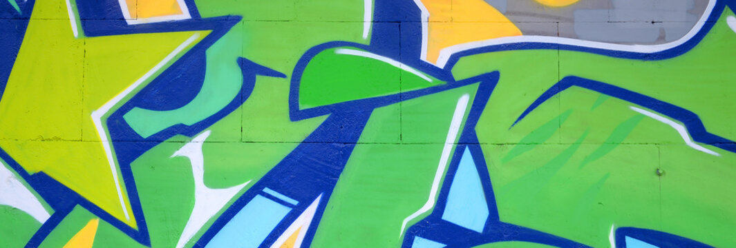 Fragment of colored street art graffiti paintings with contours and shading close up
