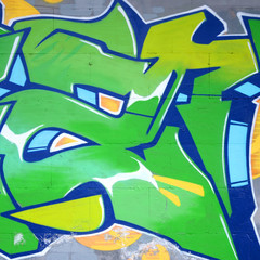 Fragment of colored street art graffiti paintings with contours and shading close up