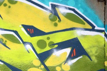 Fragment of colored street art graffiti paintings with contours and shading close up