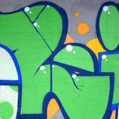 Fragment of colored street art graffiti paintings with contours and shading close up