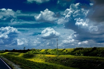 Fototapeta na wymiar landscape with road and clouds