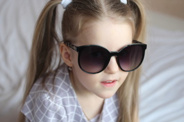 little girl in sunglasses