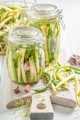 Closeup of canned green and yellow beans in the jar