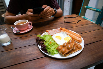 Big breakfast on a wooden table