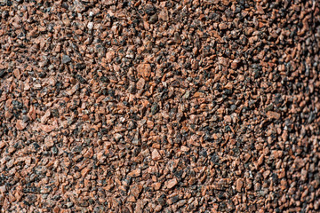 The texture of the wall of red and black stones