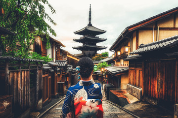 Kyoto, Japan Culture Travel - Asian traveler wearing traditional Japanese kimono walking in Higashiyama district in the old town of Kyoto, Japan.
