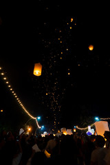 Thousands of people on Nawarat Bridge releasing Sky Lanterns for Yi Peng in Chiang Mai, Thailand celebrating a local festival of the lunar new year. 