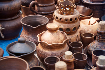 Fototapeta na wymiar Clay pottery ceramic. Several types of clay pottery pots, cups, pitchers, teapots.