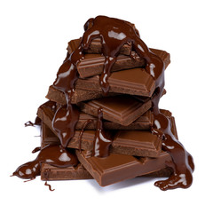 dark or milk chocolate pieces stack and chocolate syrup isolated on white
