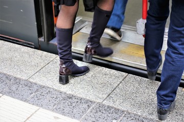 Obraz premium legs of business people walking on city street