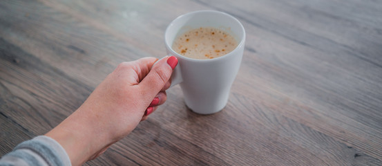 White up of coffe on wooden table, selected focus