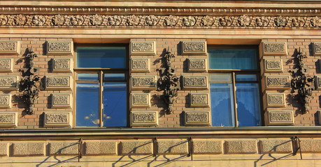 House facade exterior view of windows on ornamental european decorative house front