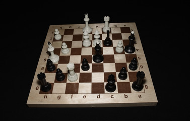 Wooden chess board under white pawns for game concept