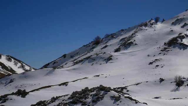 Campo dell'esule (Field of the exile), Campo dell'arco (field of the arch). Snow covered plateau with blue sky. Landscape of Matese Mountain National Park. Matese Lake, Campania, Caserta, Italy