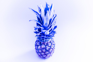 Pineapples toned image stylized neon light. Tropical background for design