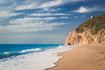 Beach in Lefkada, Greece in the afternoon with cyan blue water