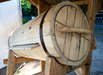 Inclined wooden board for bees placed on a stand