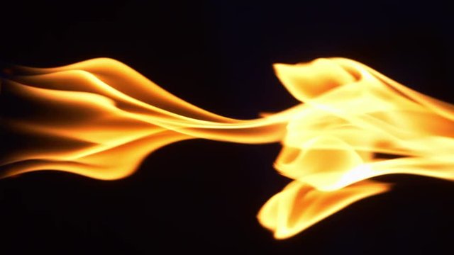  Vertical video of fire flames on the darkness in 4k slow motion 60fps