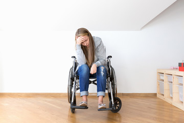 Despair young woman on wheelchair. Hard invalid concept.