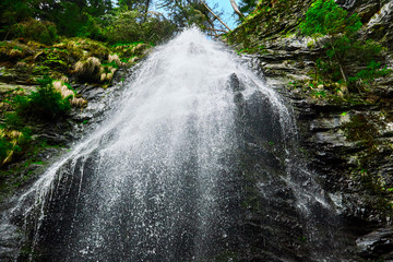 high mountain waterfall in the woods , Yalinsky mountain waterfall , Ukraine , Carpathians