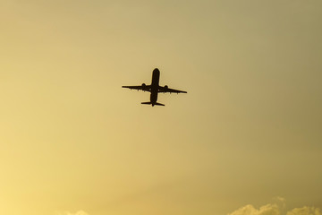 Passenger airplane taking-off in sunset
