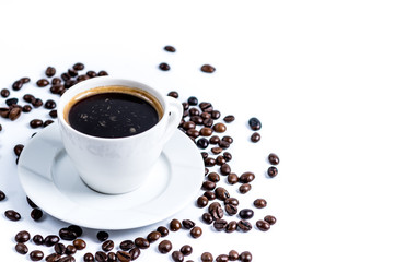 Cup with coffee beans on white background