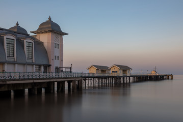 The victorian architecture of Penarth Pier, near Cardiff on the coast of south Wales. The sea is smooth due to a long shutter speed.