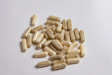 medicine capsules on white background