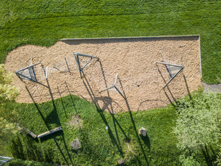 Aerial view of empty playground in park with toys for kids.