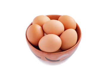 brown eggs in a pot, isolate