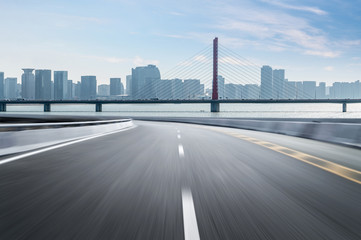 Fototapeta premium Empty road floor surface with modern city landmark buildings of hangzhou bund Skyline,zhejiang,china
