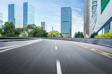 Obraz premium Empty road floor surface with modern city landmark buildings of hangzhou bund Skyline,zhejiang,china