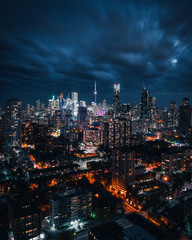 Fototapeta na wymiar Entire futuristic city skyline view of downtown Toronto Canada during a storm. Modern buildings, urban architecture, cars travelling. construction and development in a busy city