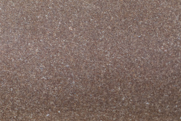 Structure of old paper of beige color with white impregnations. Ready photo background. Soft focus.