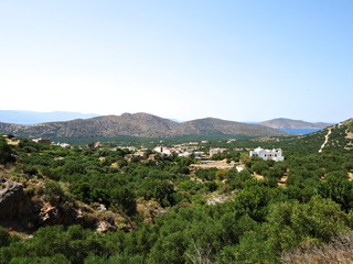 Fototapeta na wymiar Sunny view of picturesque mountain village on Crete, Greece..