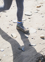 Women's hiking boots on beach