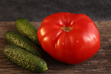 Bright vegetables on a wooden cracked board.