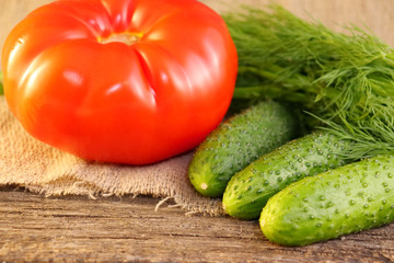 Bright vegetables on a wooden cracked board.