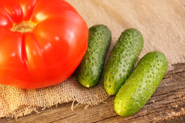 Bright vegetables on a wooden cracked board.