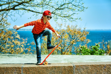 boy on a skateboard in the Park . a child learns to ride a Board
