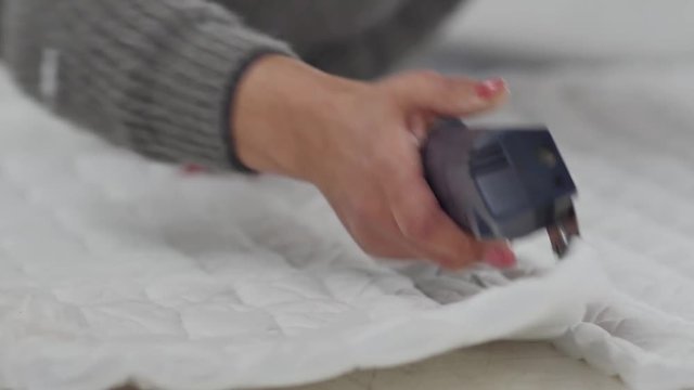 Cutting of fabric with electric knife while making mattress case
