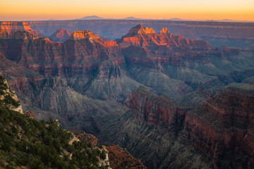 The Grand Canyon at sunset from the Southern side, the looks like it's on fire and the golden light glints off the peaks in the canyon, nobody in the picture