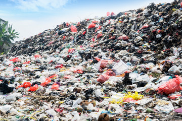 Household and plastic garbage piling at the landfill
