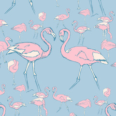 pink flamingos in water in different poses and two flamingos