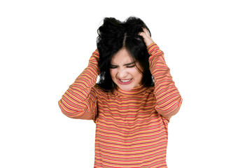 Stressed woman scratching her head on studio